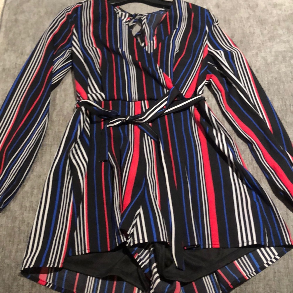 Black romper with white, pink and blue stripes